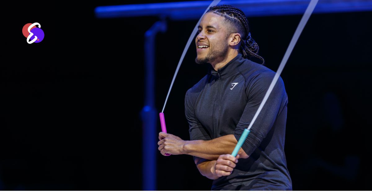 **Image Alt Text:** Person adjusting jump rope length to armpit height for proper sizing.