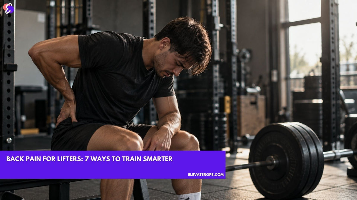 Male weightlifter sitting on a gym bench holding his lower back in discomfort after a strength training session.