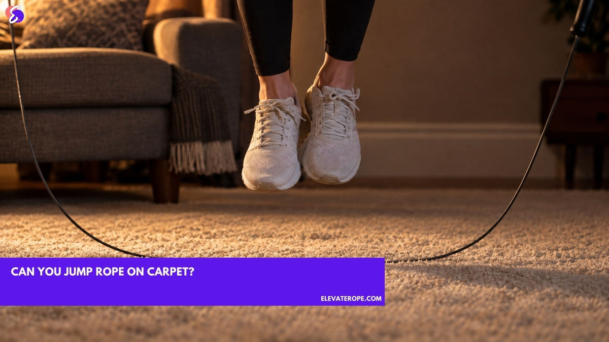 Close side view at shin height of a jump rope cable sweeping through thick pale carpet pile, the fibres parting along the cable's path, with a jumper's feet just above the floor.