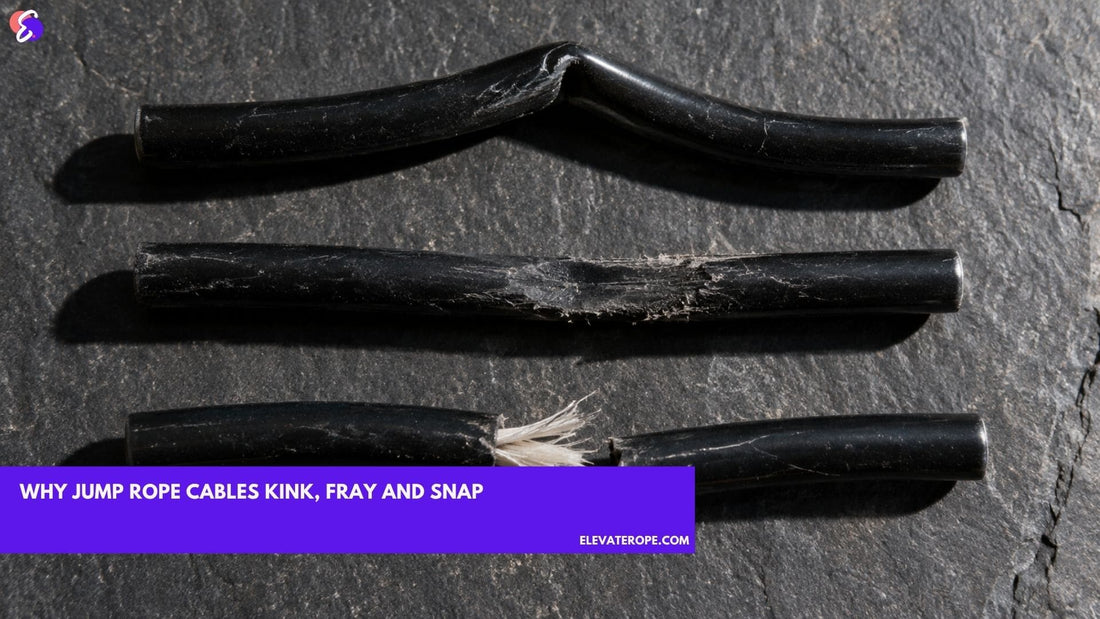 Three lengths of black PVC jump rope cable on dark slate showing a permanent kink, a flattened frayed section and a clean break with nylon core fibres exposed.